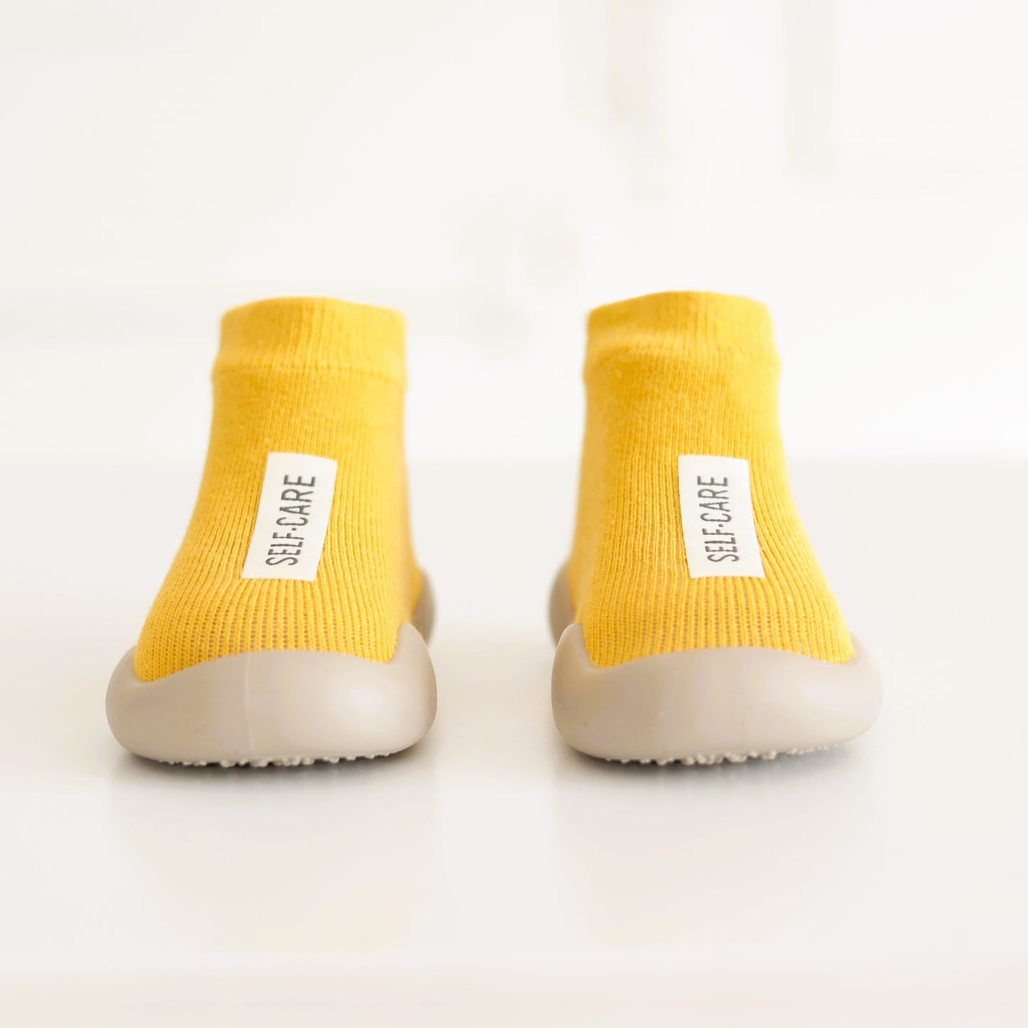 Kinder- Sockenschuhe (Currygelb)